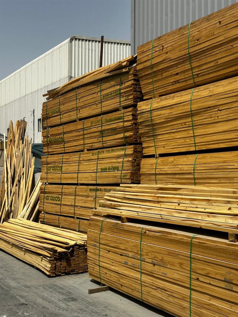 Stacked softwood lumber and planks in the yard